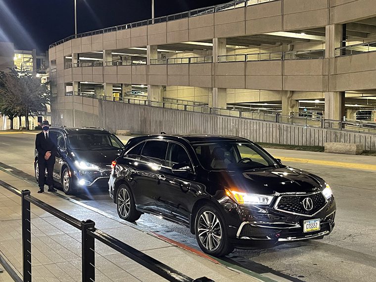 A couple of cars parked on top of a road